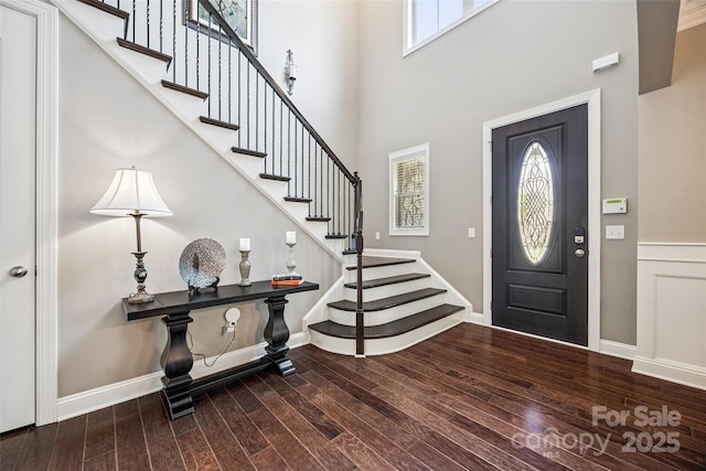 16547 Bastille Dr, Charlotte, NC 28278 - entryway with plenty of natural light, wood finished floors, stairs, and a towering ceiling