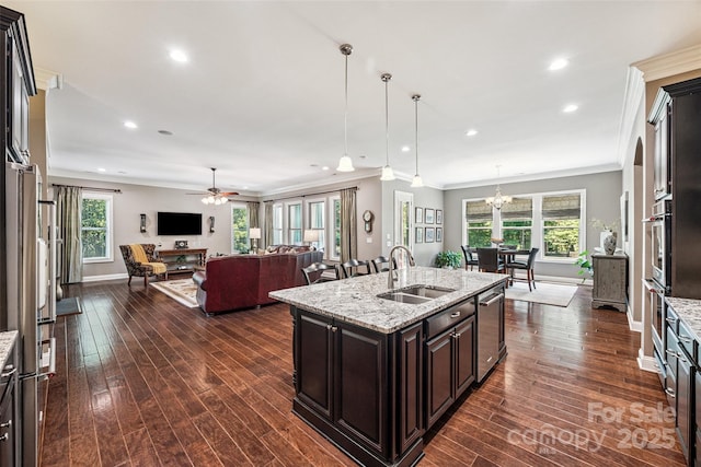 16547 Bastille Dr, Charlotte, NC 28278 - kitchen with stainless steel appliances, open floor plan, dark wood-type flooring, ornamental molding, and recessed lighting