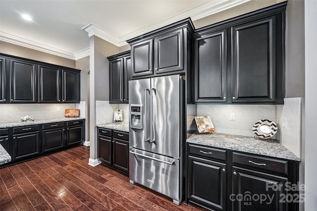 16547 Bastille Dr, Charlotte, NC 28278 - kitchen featuring high quality fridge, dark cabinetry, backsplash, ornamental molding, and dark wood finished floors