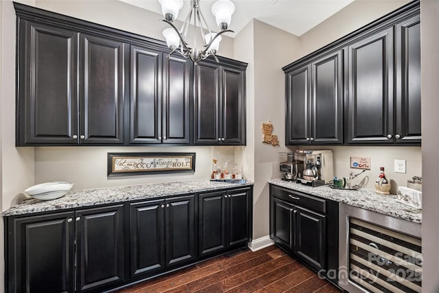 16547 Bastille Dr, Charlotte, NC 28278 - indoor bar with a chandelier, wine cooler, dark wood finished floors, and pendant lighting