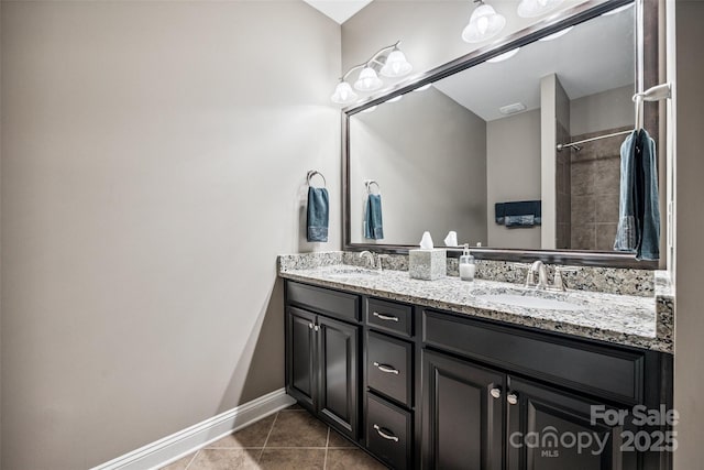 16547 Bastille Dr, Charlotte, NC 28278 - bathroom with double vanity, tile patterned flooring, and a shower