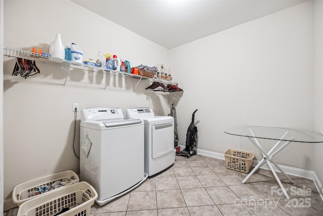 16547 Bastille Dr, Charlotte, NC 28278 - washroom featuring washer and clothes dryer and light tile patterned floors