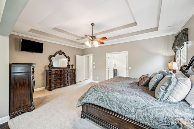 16547 Bastille Dr, Charlotte, NC 28278 - bedroom featuring a tray ceiling, light carpet, crown molding, a ceiling fan, and ensuite bath