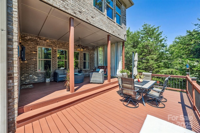 16547 Bastille Dr, Charlotte, NC 28278 - wooden deck with ceiling fan, outdoor dining area, and an outdoor living space