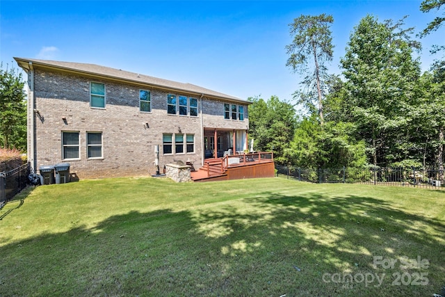 16547 Bastille Dr, Charlotte, NC 28278 - back of property with a fenced backyard, a wooden deck, and brick siding