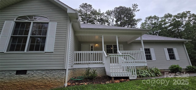 221 Flat Branch Trl, Mill Spring, NC 28756 - back of property with covered porch and crawl space