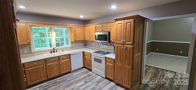 221 Flat Branch Trl, Mill Spring, NC 28756 - kitchen featuring white appliances, light wood-style flooring, light countertops, and recessed lighting