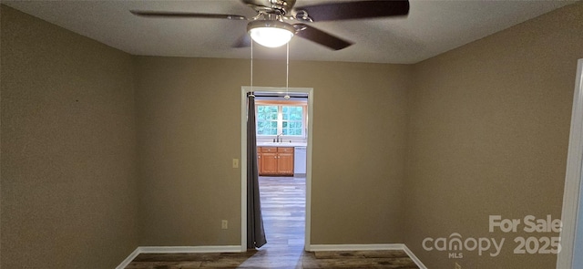 221 Flat Branch Trl, Mill Spring, NC 28756 - spare room featuring dark wood finished floors and ceiling fan