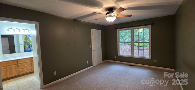 221 Flat Branch Trl, Mill Spring, NC 28756 - unfurnished bedroom with light carpet, ensuite bath, and a ceiling fan