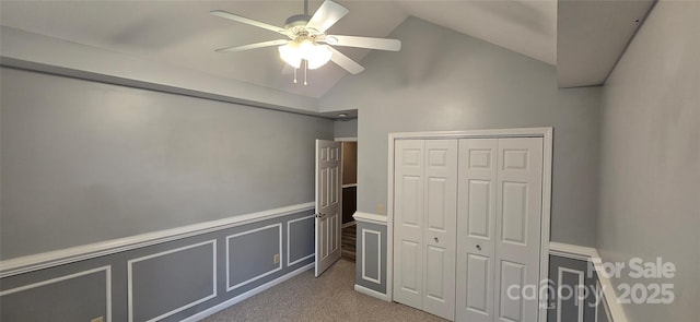 221 Flat Branch Trl, Mill Spring, NC 28756 - unfurnished bedroom featuring lofted ceiling, carpet flooring, ceiling fan, a closet, and wainscoting