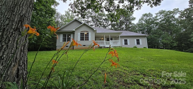 221 Flat Branch Trl, Mill Spring, NC 28756 - view of front facade with crawl space, covered porch, and a front yard