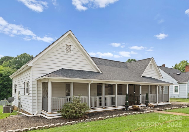 515 N Main Gq St, Granite Quarry, NC 28146 - back of house featuring a shingled roof, a yard, and a sunroom