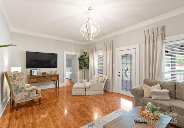 515 N Main Gq St, Granite Quarry, NC 28146 - living room featuring a chandelier, ornamental molding, and wood finished floors