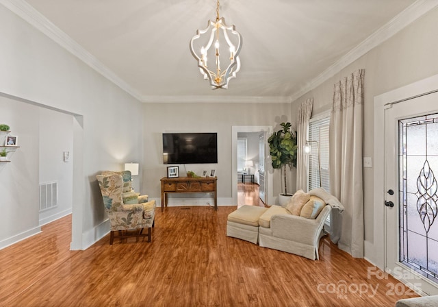 515 N Main Gq St, Granite Quarry, NC 28146 - living area featuring a chandelier, wood finished floors, and crown molding