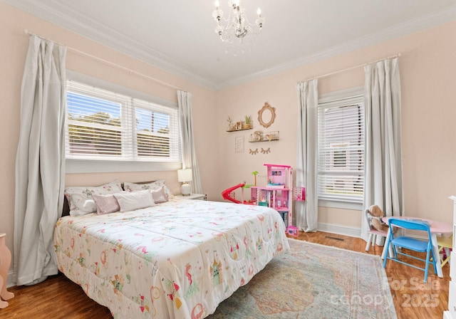 515 N Main Gq St, Granite Quarry, NC 28146 - bedroom with ornamental molding, a chandelier, and wood finished floors