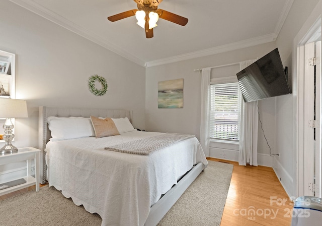 515 N Main Gq St, Granite Quarry, NC 28146 - bedroom featuring ornamental molding, light wood-type flooring, and a ceiling fan