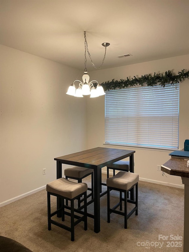 13116 Erwin Rd, Charlotte, NC 28273 - dining room with a chandelier and carpet flooring