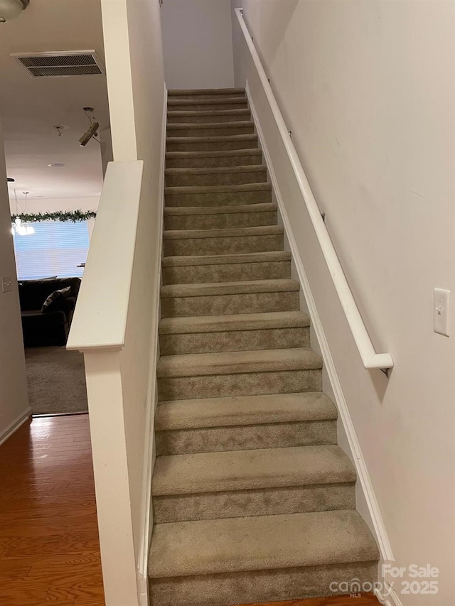 13116 Erwin Rd, Charlotte, NC 28273 - stairs featuring wood finished floors
