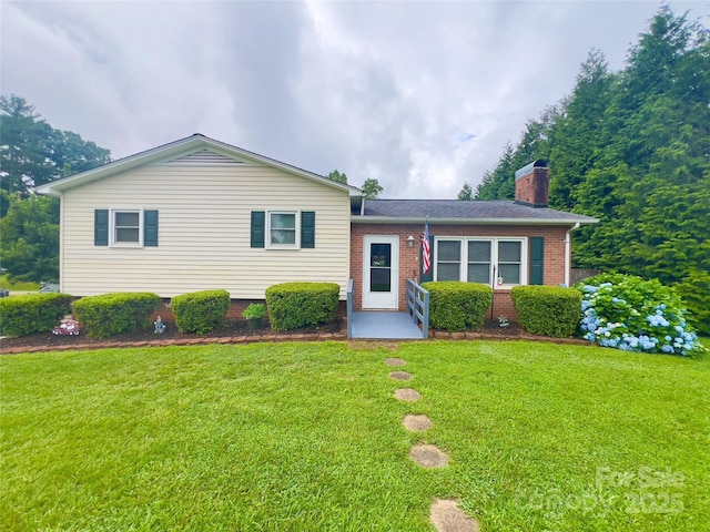 803 Bannon Pl, Lenoir, NC 28645 - tri-level home featuring brick siding, a front yard, and a chimney