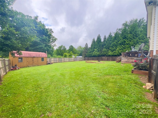 803 Bannon Pl, Lenoir, NC 28645 - fenced backyard featuring a deck and a storage unit