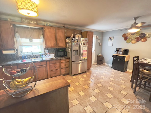 803 Bannon Pl, Lenoir, NC 28645 - kitchen with stainless steel refrigerator with ice dispenser, a ceiling fan, black microwave, dark countertops, and ornamental molding