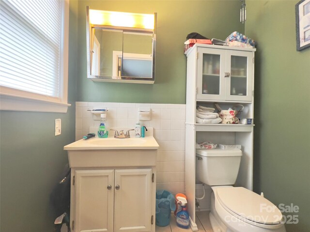 803 Bannon Pl, Lenoir, NC 28645 - half bathroom featuring vanity, tile walls, wainscoting, and tile patterned floors