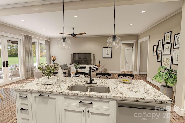 2106 Piper Ridge Dr, Lenoir, NC 28645 - kitchen featuring wood finished floors, white cabinets, a ceiling fan, open floor plan, and light stone counters