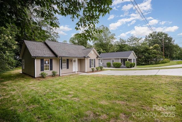 903 Brookdale St, Kannapolis, NC 28083 - ranch-style house featuring a front lawn and roof with shingles