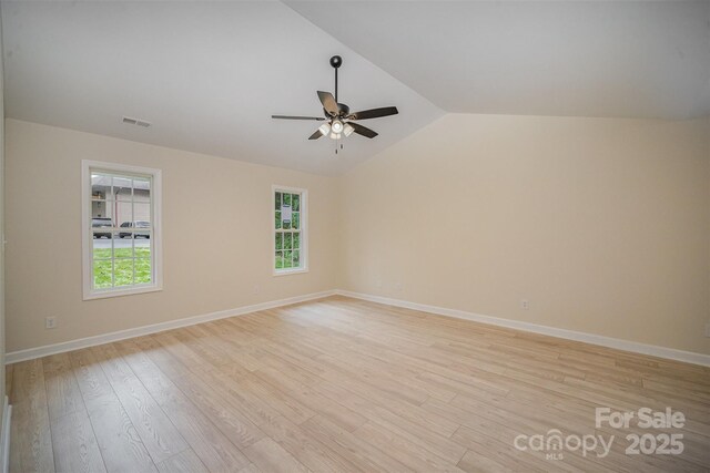 903 Brookdale St, Kannapolis, NC 28083 - unfurnished room featuring a ceiling fan, light wood-style floors, and vaulted ceiling