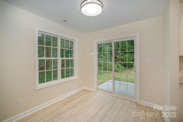 903 Brookdale St, Kannapolis, NC 28083 - unfurnished room with baseboards and light wood finished floors
