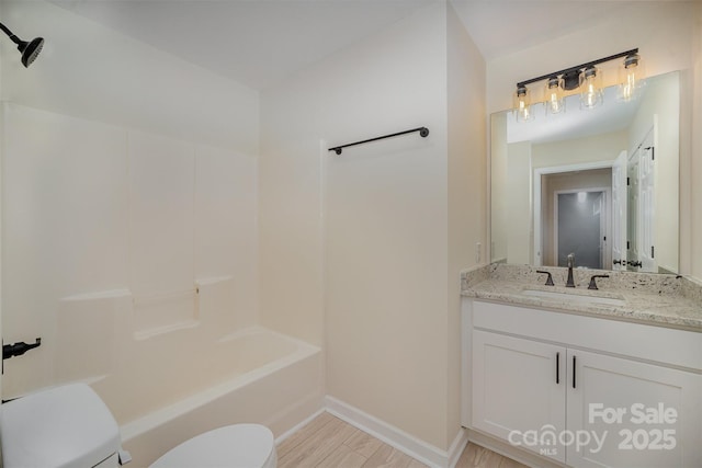 903 Brookdale St, Kannapolis, NC 28083 - bathroom featuring vanity, wood finished floors, and  shower combination
