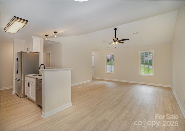 903 Brookdale St, Kannapolis, NC 28083 - kitchen featuring stainless steel appliances, white cabinets, light wood finished floors, lofted ceiling, and ceiling fan