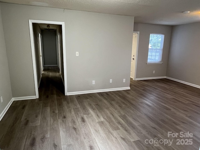 1714 Maribel Ave, Charlotte, NC 28216 - empty room with dark wood-style flooring and a textured ceiling