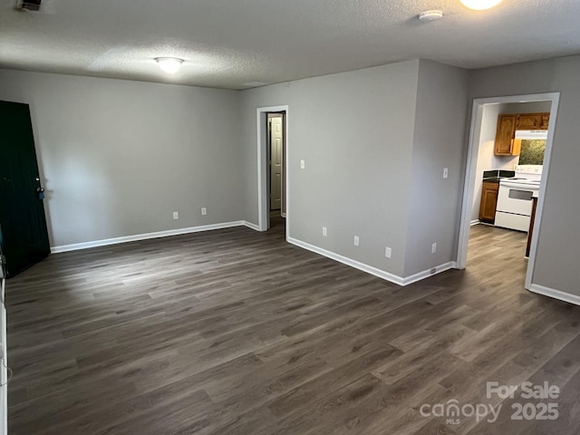 1714 Maribel Ave, Charlotte, NC 28216 - unfurnished room with a textured ceiling, dark wood-style flooring, and a smoke detector