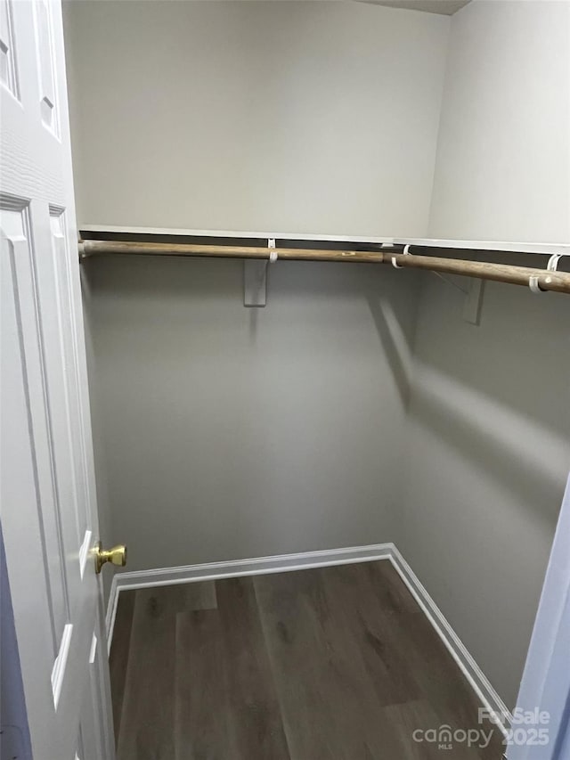1714 Maribel Ave, Charlotte, NC 28216 - walk in closet featuring dark wood-type flooring