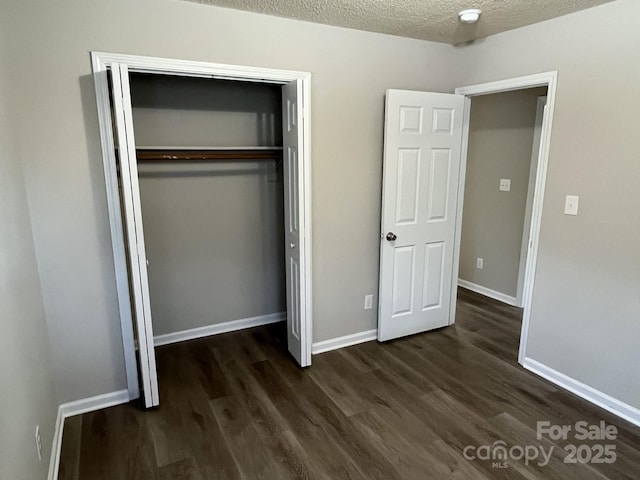1714 Maribel Ave, Charlotte, NC 28216 - unfurnished bedroom featuring dark wood-style flooring, a closet, and a textured ceiling