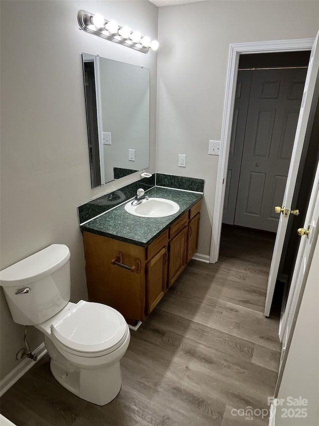 1714 Maribel Ave, Charlotte, NC 28216 - half bathroom with vanity and wood finished floors