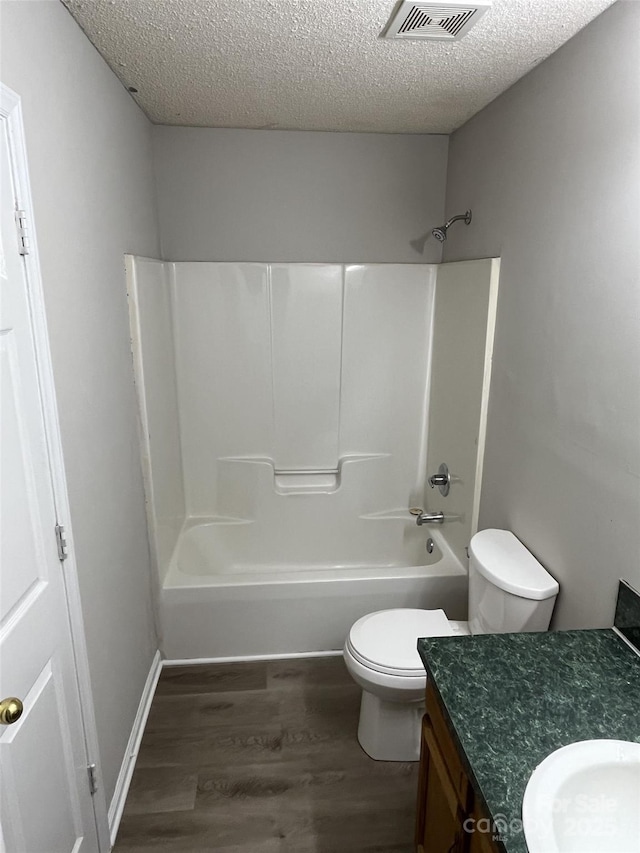 1714 Maribel Ave, Charlotte, NC 28216 - full bath featuring vanity, wood finished floors, a textured ceiling, and shower / washtub combination