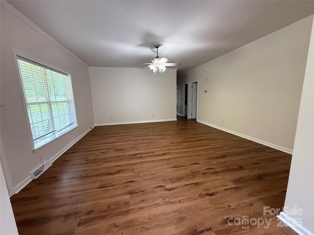 40287 Palmerville Rd, New London, NC 28127 - empty room with crown molding, a ceiling fan, and wood finished floors