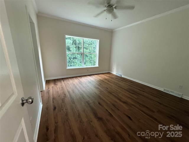 40287 Palmerville Rd, New London, NC 28127 - spare room with dark wood finished floors, ornamental molding, and ceiling fan