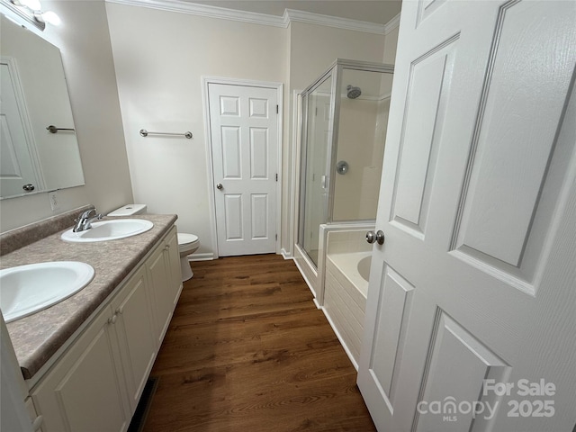 40287 Palmerville Rd, New London, NC 28127 - bathroom with ornamental molding, a stall shower, a garden tub, double vanity, and wood finished floors