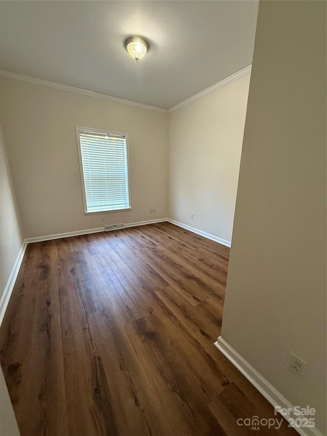 40287 Palmerville Rd, New London, NC 28127 - unfurnished room featuring ornamental molding and dark wood-style flooring