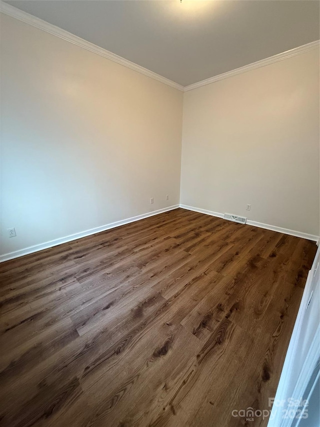 40287 Palmerville Rd, New London, NC 28127 - unfurnished room with ornamental molding and dark wood finished floors