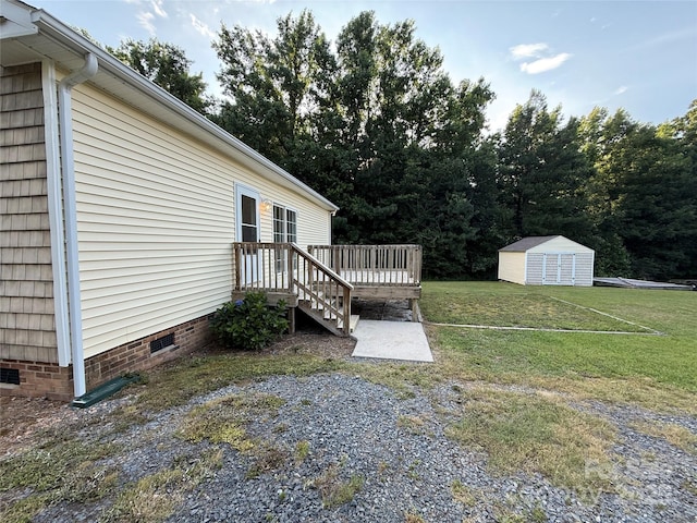 40287 Palmerville Rd, New London, NC 28127 - view of green lawn with a wooden deck and a shed