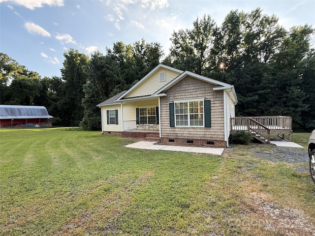 40287 Palmerville Rd, New London, NC 28127 - view of front of house featuring crawl space, a front lawn, covered porch, and a wooden deck