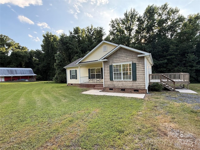 40287 Palmerville Rd, New London, NC 28127 - view of front of house with crawl space, a front lawn, and covered porch