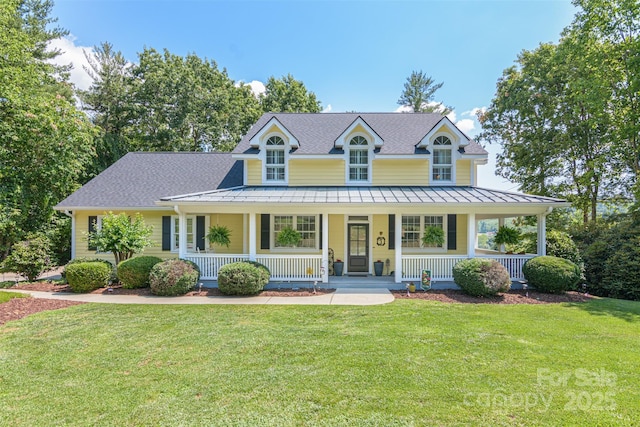 3 Chickadee Ln, Fairview, NC 28730 - view of front of home featuring a standing seam roof, covered porch, and a front lawn