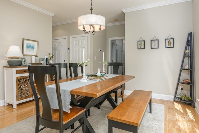 3 Chickadee Ln, Fairview, NC 28730 - dining room featuring light wood finished floors, crown molding, and a chandelier