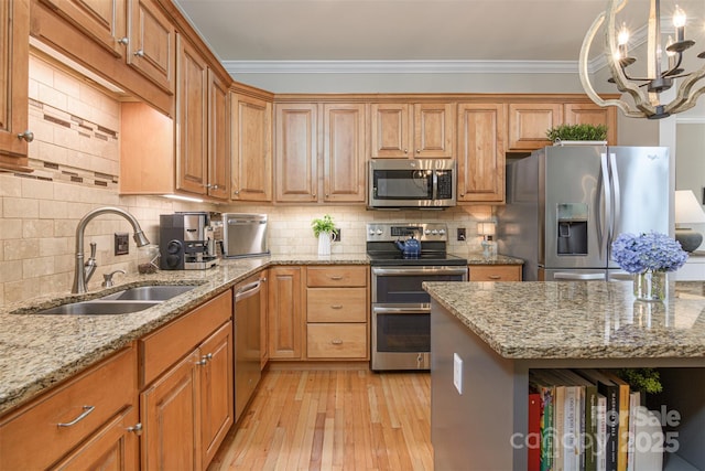 3 Chickadee Ln, Fairview, NC 28730 - kitchen featuring stainless steel appliances, light stone counters, crown molding, tasteful backsplash, and light wood-style floors