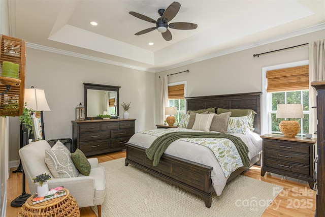 3 Chickadee Ln, Fairview, NC 28730 - bedroom featuring a raised ceiling, light wood-style floors, recessed lighting, a ceiling fan, and crown molding